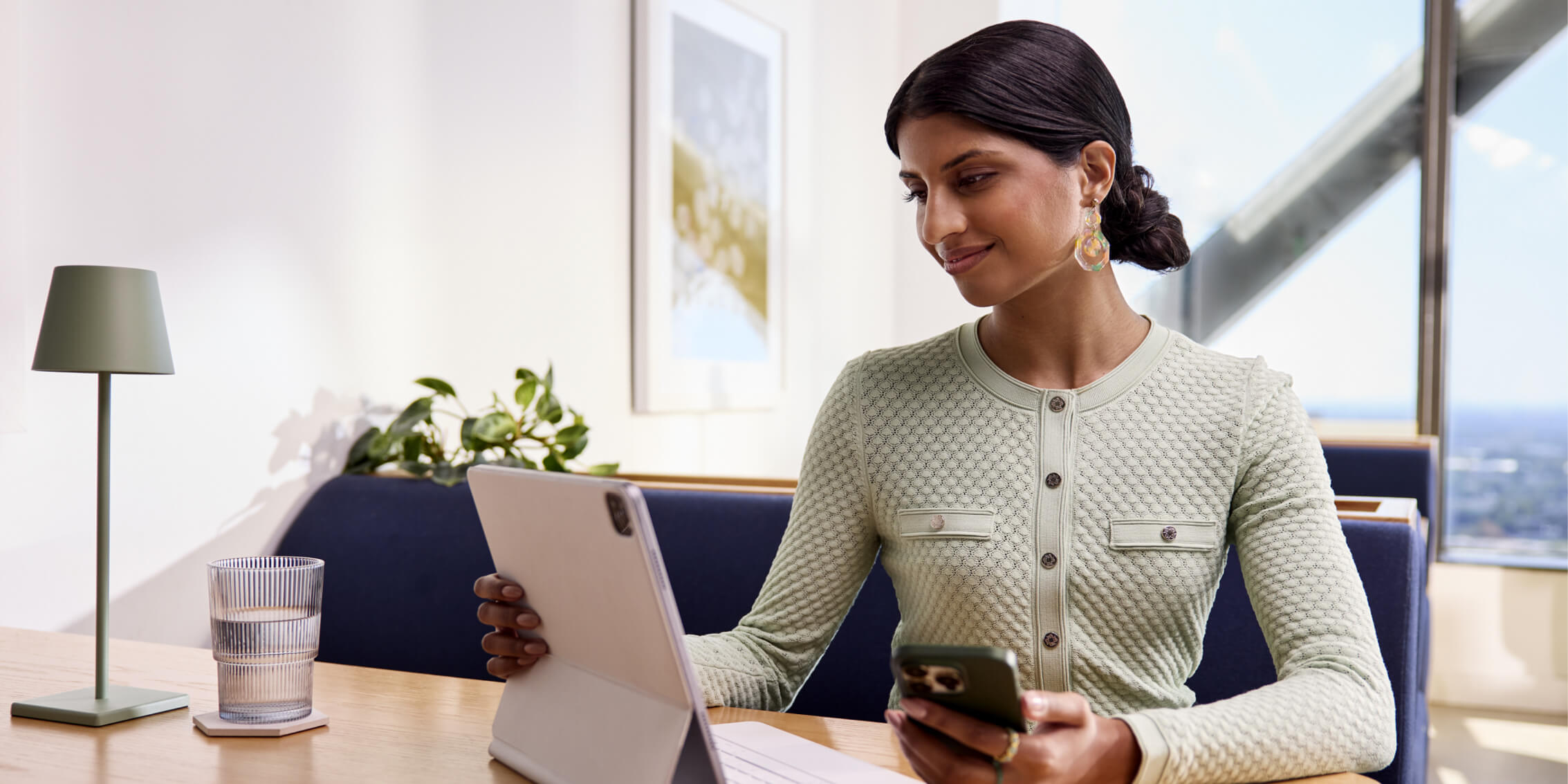 A woman uses a human resources management system.