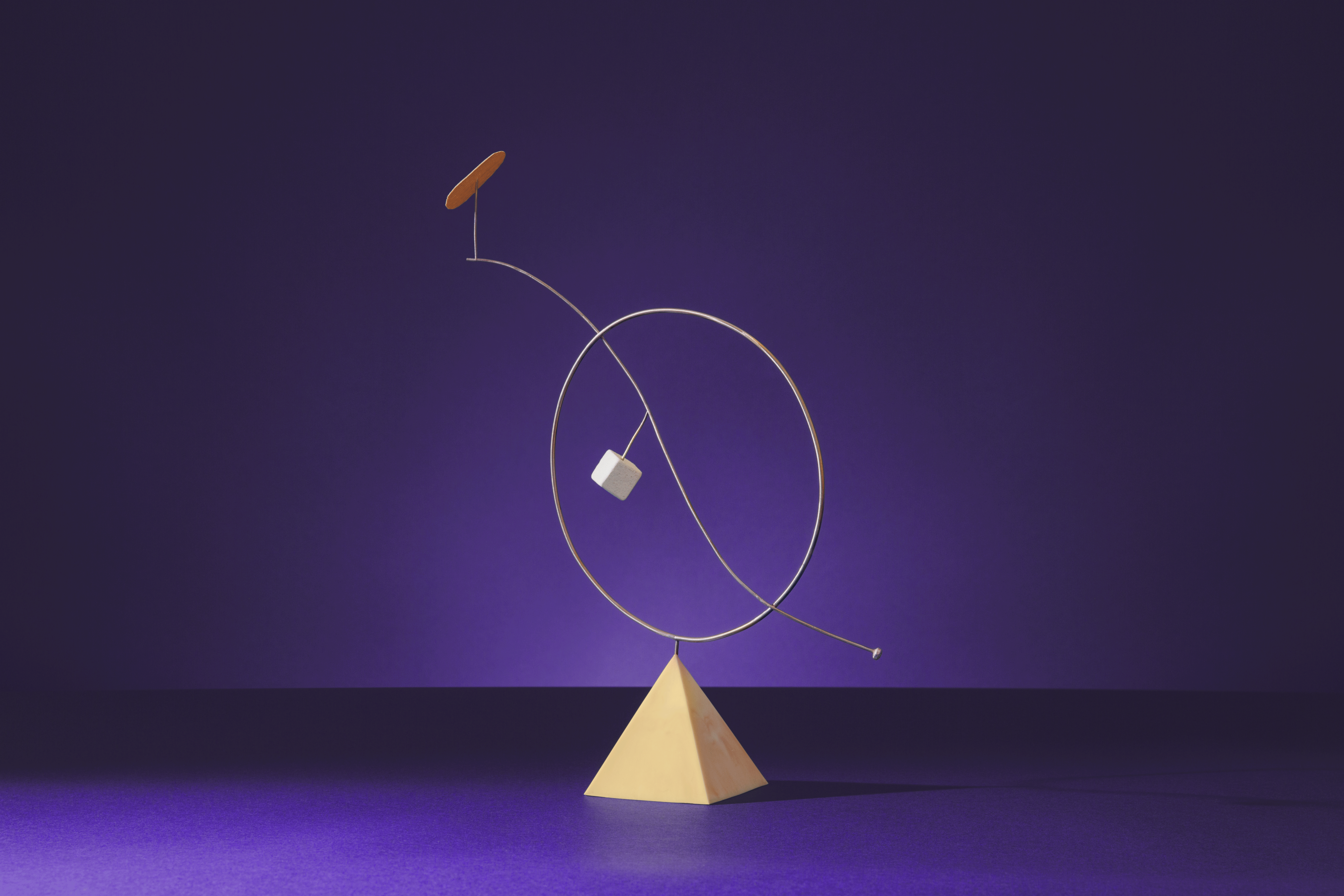 Abstract art sculpture on a purple background