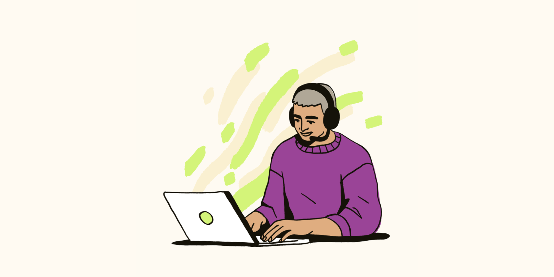 A man with a headset is working on a laptop.